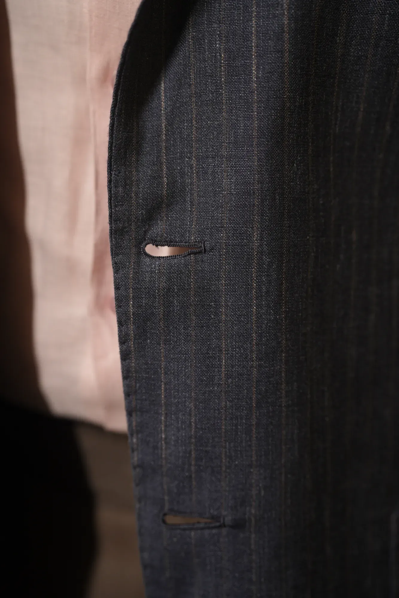 Lapel buttonhole on a navy chalk-stripe jacket